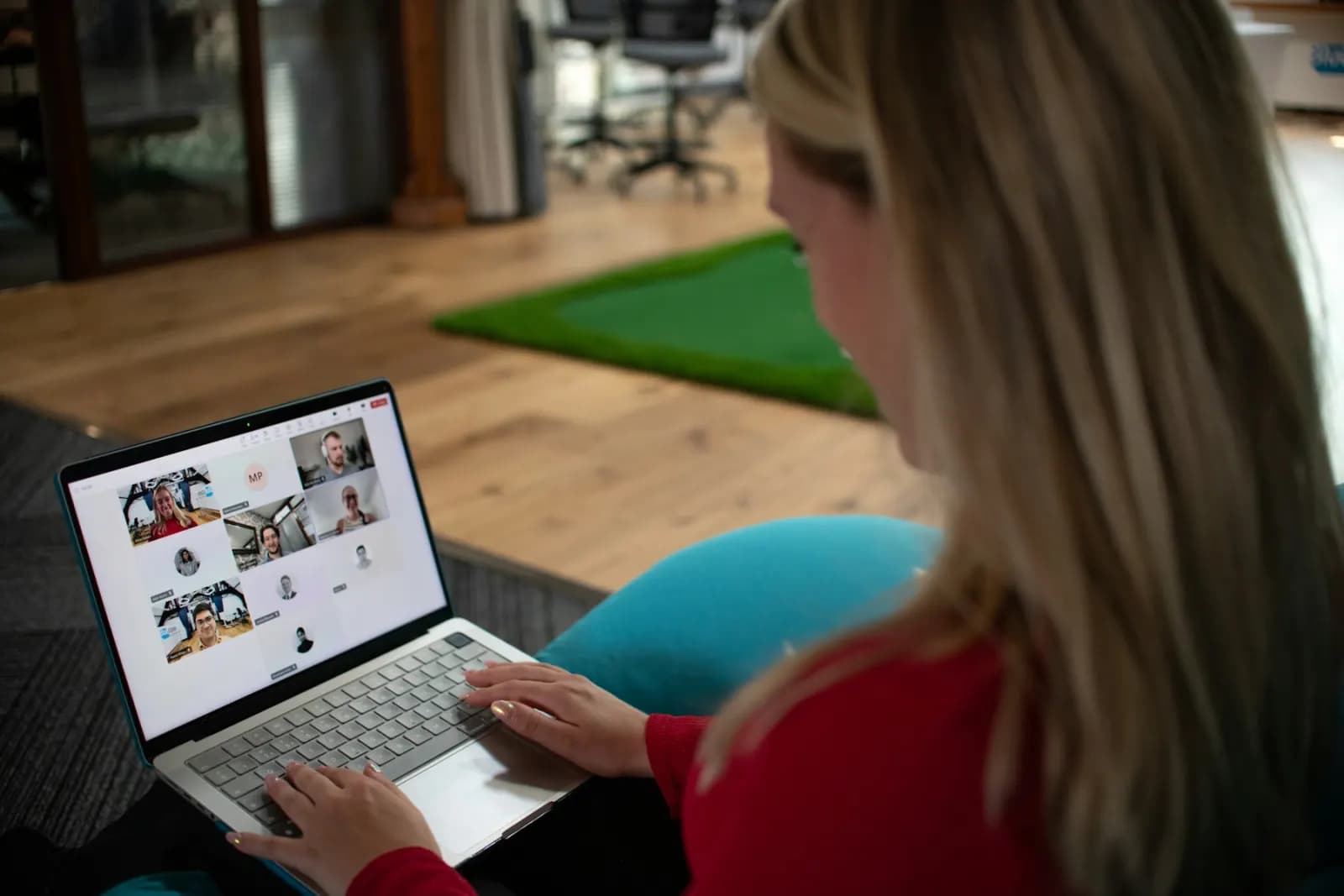 A remote video meeting running on a laptop