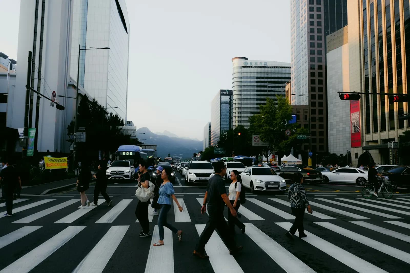 People crossing a busy city crosswalk